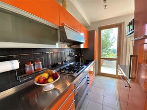 Cabinetry, Food, Countertop, Kitchen Appliance, Kitchen Stove, Gas Stove, Kitchen, Home Appliance, Orange, Wood