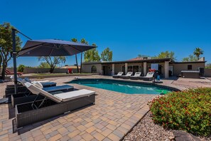 Beautiful heated pool with 10 lounge chairs to lay out on!