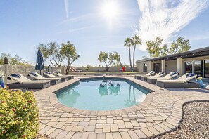 Beautiful heated pool with 10 lounge chairs to lay out on!