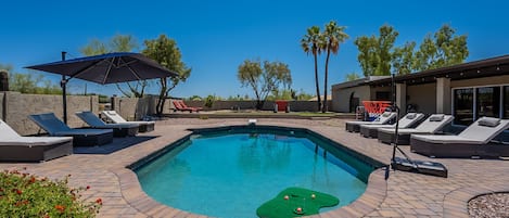 Beautiful heated pool with 10 lounge chairs to lay out on!