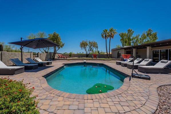 Beautiful heated pool with 10 lounge chairs to lay out on!