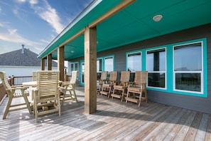 Eat alfresco style on the deck with an outdoor table set for four