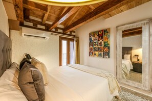 Main view of the bedroom with exterior balcony
