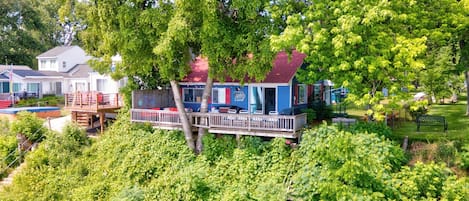 Home surrounded by beautiful lush greenery overlooking Lake Huron