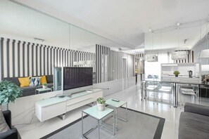Views of the living room and a part of the kitchen
