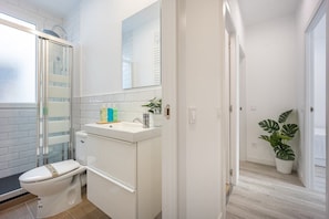 Main view of one of the bathrooms with a shower tray and amenities