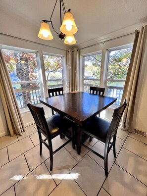 Upper Level:  2nd dining table on upper level with a lake view
