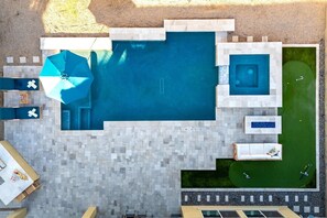 Aerial View | Backyard with Pool, Hot Tub & Putting Green Your private outdoor oasis with a gas-heated pool, hot tub, and putting green, perfect for relaxation and fun.