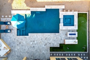 Aerial View | Backyard with Pool, Hot Tub & Putting Green Your private outdoor oasis with a gas-heated pool, hot tub, and putting green, perfect for relaxation and fun.