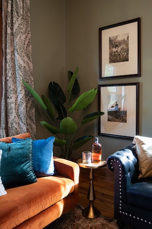 Beautiful natural light peeks through the historical, unique front window.