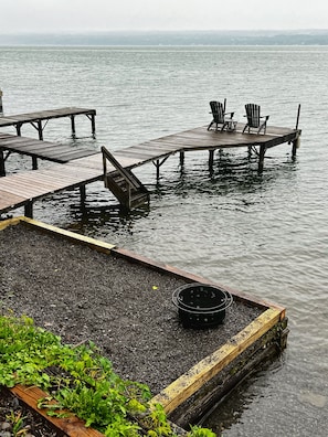 View of firepit and dock from parking area
