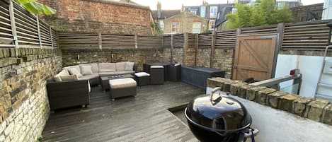 Sun-drenched Patio with seating and BBQ