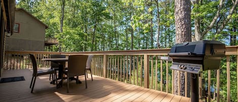 Sit out on your private furnished deck to relax and enjoy the fresh air and lovely view. The gas grill here is perfect for all your grilling needs!