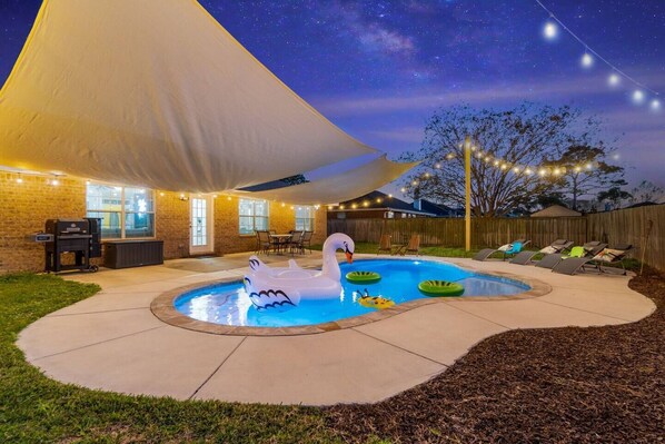 Backyard oasis with Edison lights and private pool 