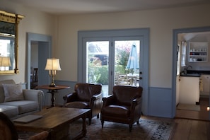 Sitting room connecting to kitchen, dining and patio