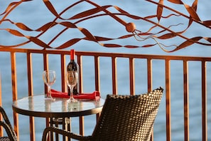 Private balcony with bistro set to enjoy the bayside experience.