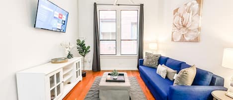 Welcome to your 700 sq ft. Suite with high ceilings.  Sit back and relax in the living room area that includes (1) sofa bed and (1) futon as well as a 50 inch ROKU Smart TV