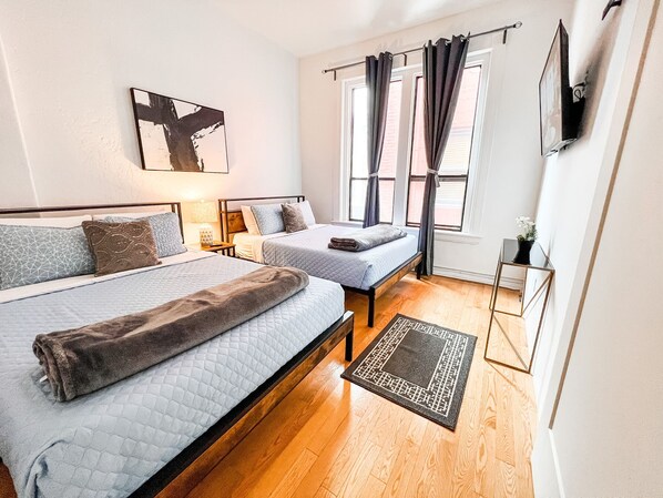 Welcome to your 700 sq ft. Suite with high ceilings.   BEDROOM No. 1: Includes (2) Queen beds with all pillows, linens and blankets as well as a 50 inch ROKU Smart TV