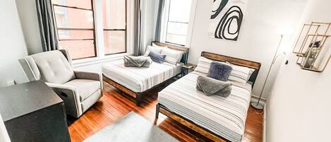 Welcome to your 700 sq ft suite with high ceilings.  BEDROOM No. 1: Includes (2) Full beds with all pillows, linens and blankets as well as a 50 inch ROKU Smart TV (Central HVAC throughout entire suite)