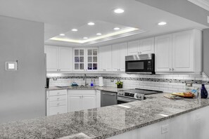 Kitchen - Newly renovated with updated appliances and stone counters
