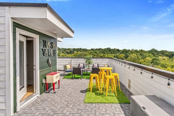 Our sprawling rooftop lounge offers ample patio seating and bar seating, corn hole boards, and stellar views.