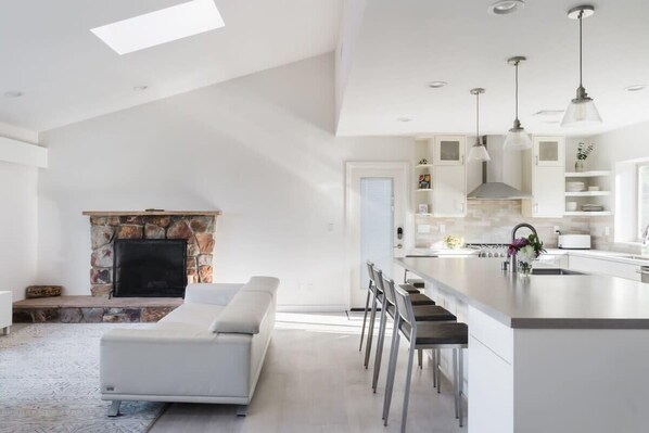 Spacious Kitchen and Living Area Flooded with Natural Light

