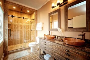 Beautiful ensuite with dual sinks and rainfall shower head.