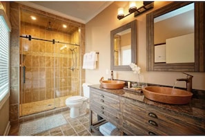 Ensuite with dual sinks and rainfall shower head.