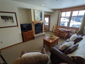 Stay cozy by the fireplace while watching all the action