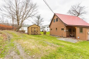 Front of house, Driveway and Shed.  