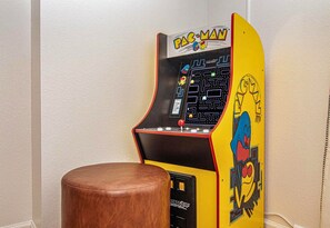 Score high in fun with this vintage arcade game, a nostalgic touch to your relaxing retreat.