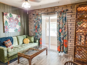 UPSTAIRS: This sitting area is located on the top floor between the four bedrooms. Relax in peace while watching the lake.