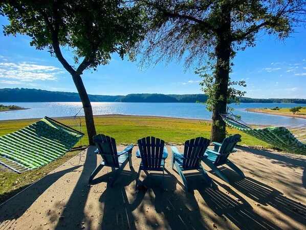 BACKYARD: Go jump in the lake! Or take it all in from the double hammocks or Adirondack chairs. 