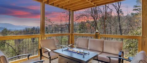 Outside seating area with gas fire pit table and stunning view of the Smokies!