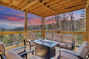 Outside seating area with gas fire pit table and stunning view of the Smokies!