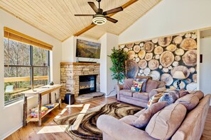 Living room features modern design with magnificent view of of the Smokies.