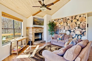 Living room features modern design with magnificent view of of the Smokies.