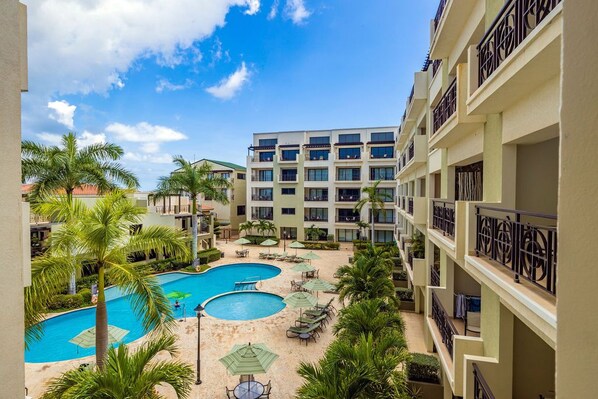 The pool area is the ideal place to unwind and enjoy the sun on our comfortable lounge chairs, or to cool off in our beautifully designed pool. The pool area is designed for unwinding in the sun, under the parasols, or in the pool.