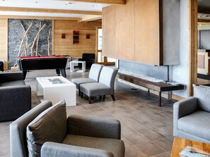 Furniture, Couch, Living Room, Floor, Flooring, Wood, Comfort, Wall, Building, Shade