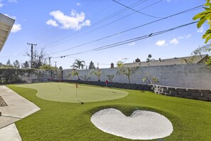 5 hole putting green with a bunker