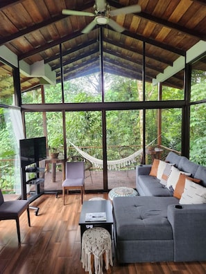 Interior View of living room with the rainforest as the backdrop!