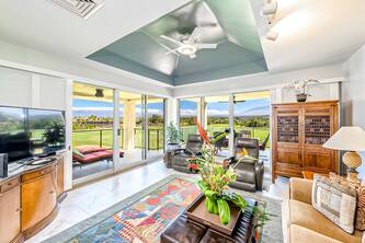 Spacious golf course condo with lanai, sweeping views, hot tub, & pool