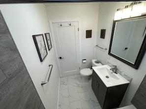 Great bathroom with clean, modern tile finish.