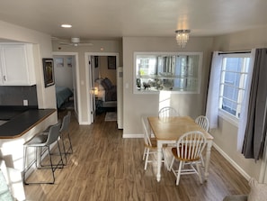 Spacious dining area with big table. also doubles as a great workstation.