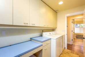 Mud room entrance and laundry facilities, the first door on the left from the covered breezeway