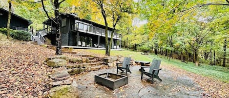 Located on Mount Sequoyah, the newly-remodeled Woods on Sequoyah has TWO luxury units overlooking the Ozarks.Out back, walk down the stone pathway to access our third outdoor seating area, which has a fire pit (newly added) and plenty of seating.