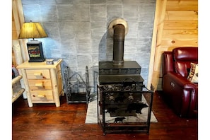 Wood burning fire place for that authentic cabin feel. Grab the bean bags...