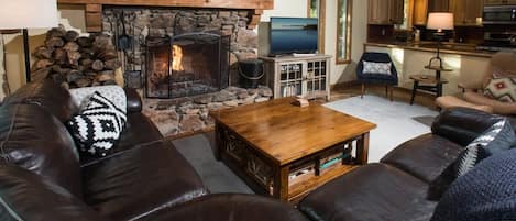 Warm up by the wood fireplace and connect with your group as you relax on the comfortable living room sofa.