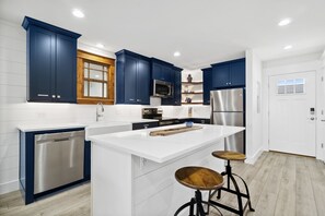 New cabinets and stainless steel appliances.