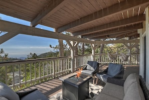 Enjoy the fire pit and swinging hammock chairs while gazing for miles